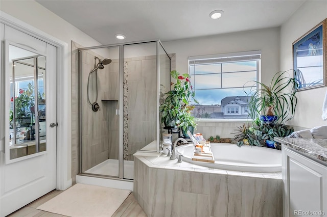 full bath featuring a shower stall and a bath