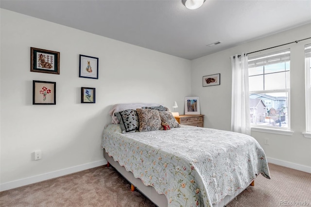bedroom featuring carpet flooring and baseboards