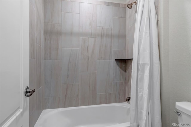 full bath with shower / bath combo with shower curtain and toilet