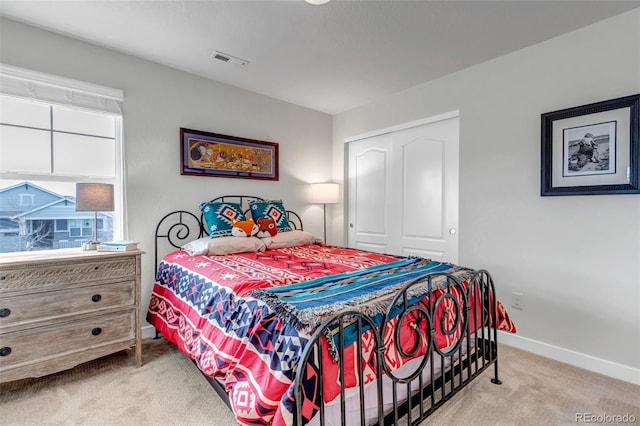 carpeted bedroom with baseboards