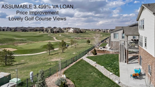 8255 S Vandriver Way, Aurora, CO 80016 - view of yard featuring a residential view, a patio, view of golf course, and a putting area