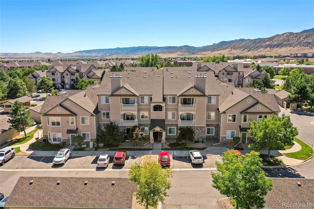 bird's eye view featuring a residential view and a mountain view