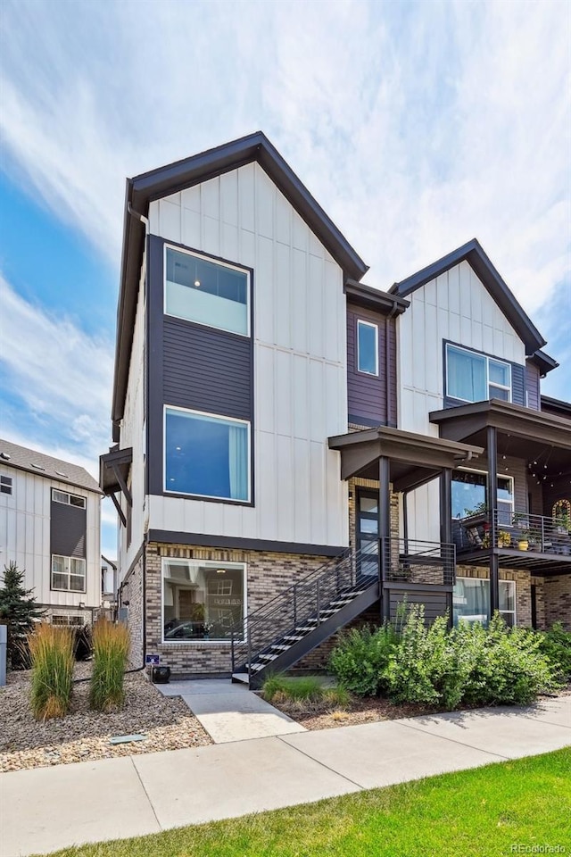 12320 W 51st Ave, Wheat Ridge, CO 80033 - contemporary house with board and batten siding, stairway, and stone siding