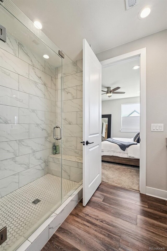 12320 W 51st Ave, Wheat Ridge, CO 80033 - bathroom with connected bathroom, wood finished floors, a stall shower, ceiling fan, and recessed lighting