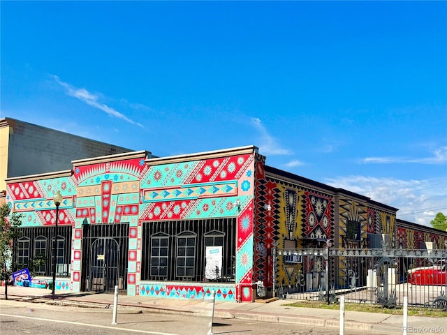 view of building exterior featuring fence