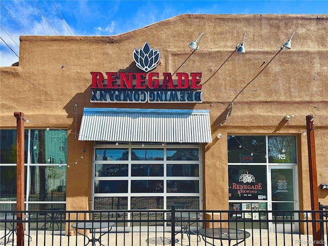view of building exterior with fence