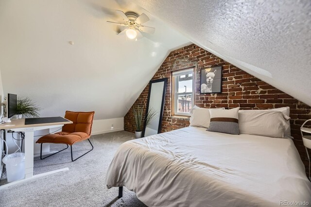 carpeted bedroom featuring brick wall, lofted ceiling, a textured ceiling, ceiling fan, and baseboards