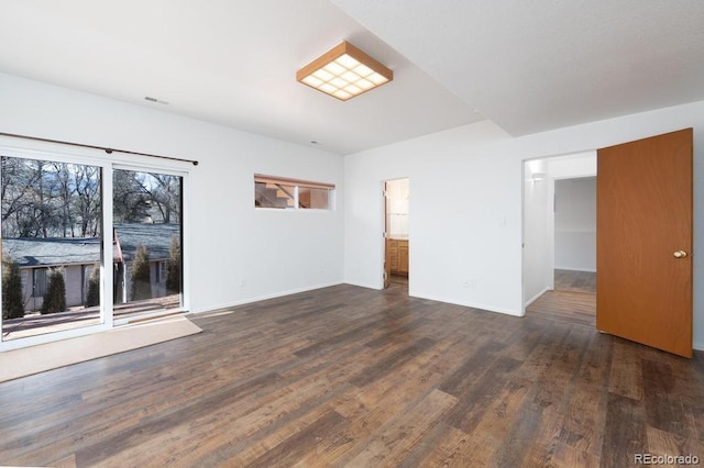 spare room with dark hardwood / wood-style flooring