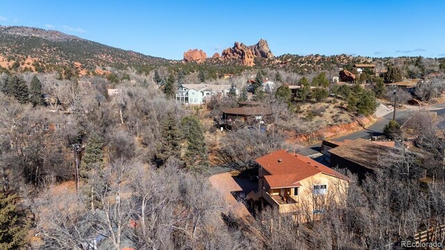 birds eye view of property with a mountain view