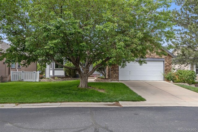 12277 W Chenango Dr, Morrison, CO 80465 - view of property hidden behind natural elements with concrete driveway and a garage