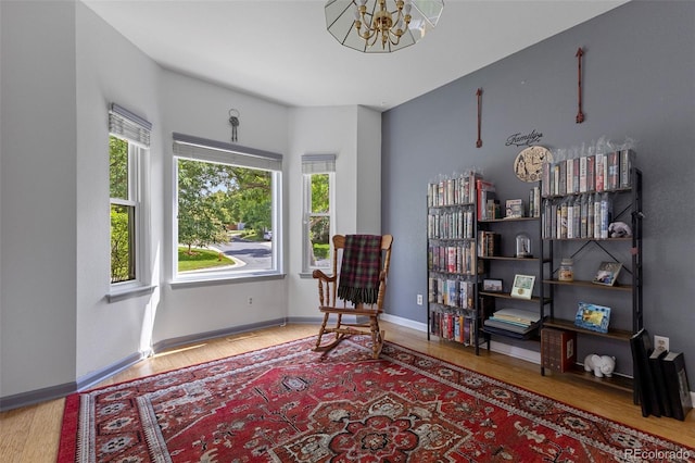 12277 W Chenango Dr, Morrison, CO 80465 - sitting room featuring a chandelier and wood finished floors