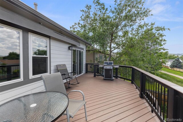 12277 W Chenango Dr, Morrison, CO 80465 - wooden deck with a grill