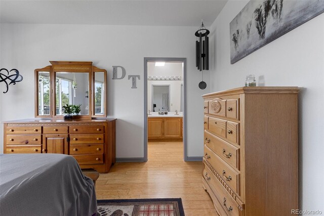 12277 W Chenango Dr, Morrison, CO 80465 - bedroom featuring light wood-style floors and connected bathroom