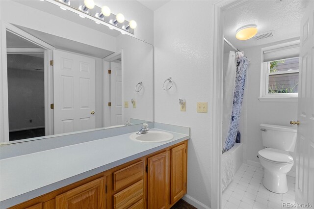 12277 W Chenango Dr, Morrison, CO 80465 - full bathroom with vanity, shower / bathtub combination with curtain, and tile patterned floors