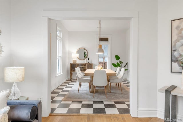 dining room with tile patterned floors and baseboards