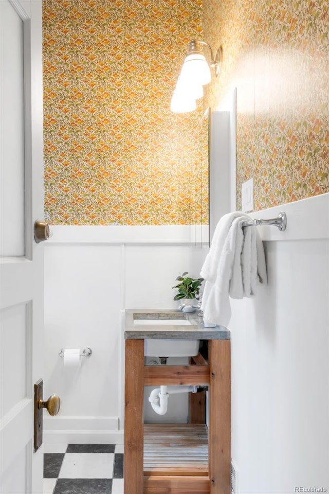 bathroom featuring tile patterned floors and wallpapered walls