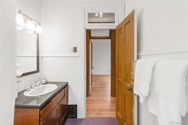 bathroom featuring vanity, wood finished floors, and visible vents
