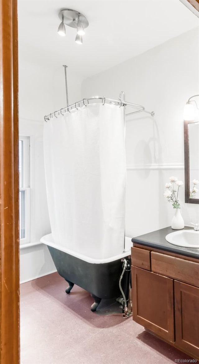 bathroom featuring vanity and shower / tub combo