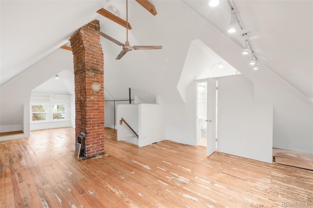 bonus room featuring wood-type flooring, decorative columns, and lofted ceiling