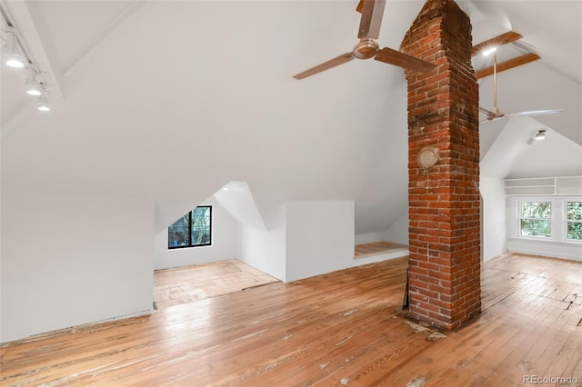 additional living space featuring a ceiling fan, decorative columns, lofted ceiling, and hardwood / wood-style floors