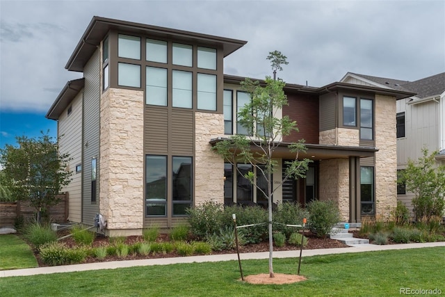 view of front of home with a front lawn