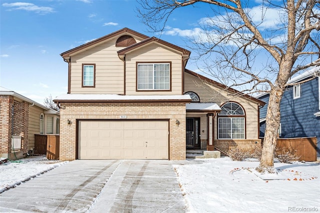 front of property with a garage