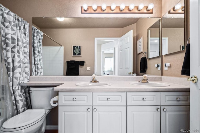 full bathroom featuring vanity, toilet, and shower / tub combo