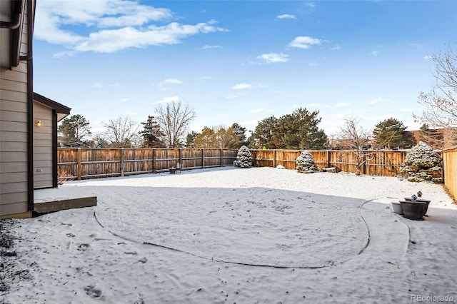 view of yard covered in snow