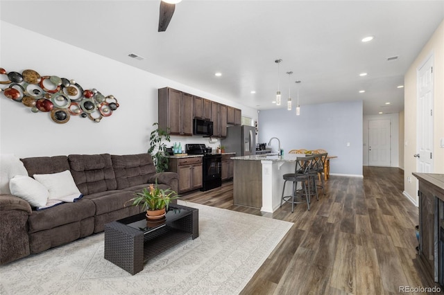 9628 Albion Ln, Thornton, CO 80229 - living room with wood finished floors and recessed lighting