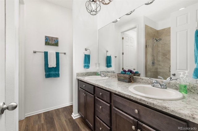 9628 Albion Ln, Thornton, CO 80229 - full bath with a stall shower, double vanity, and wood finished floors