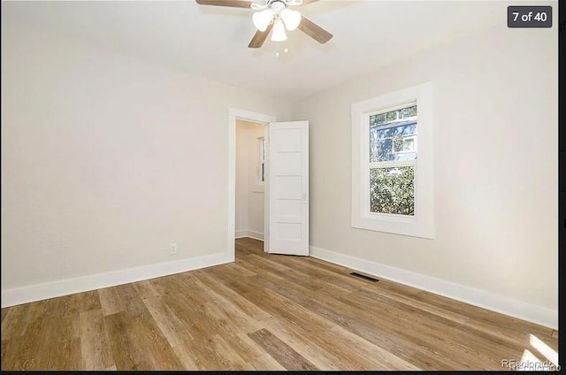 empty room with light hardwood / wood-style flooring and ceiling fan