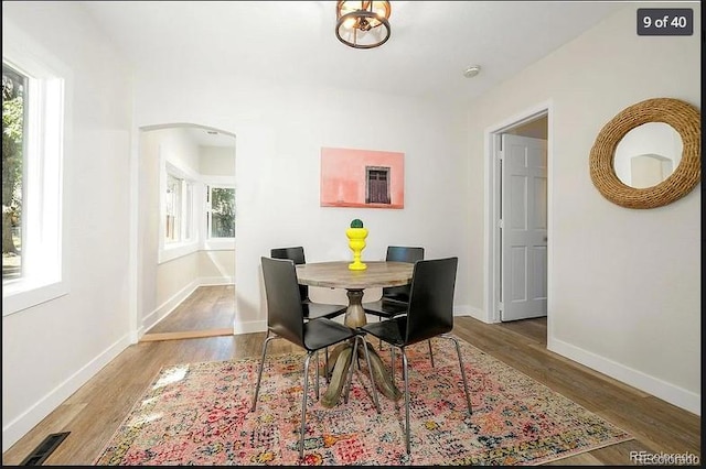 dining area with hardwood / wood-style flooring