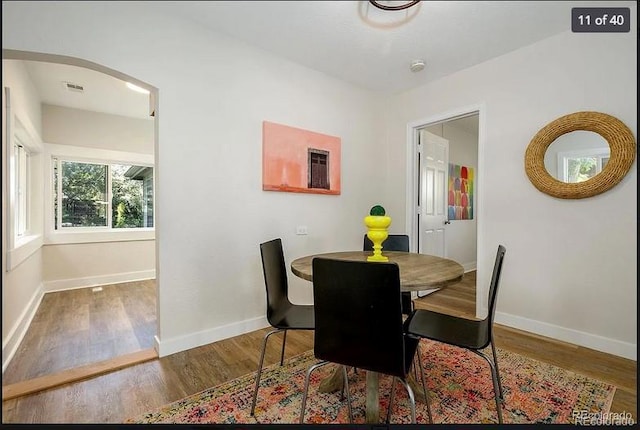 dining area featuring hardwood / wood-style floors