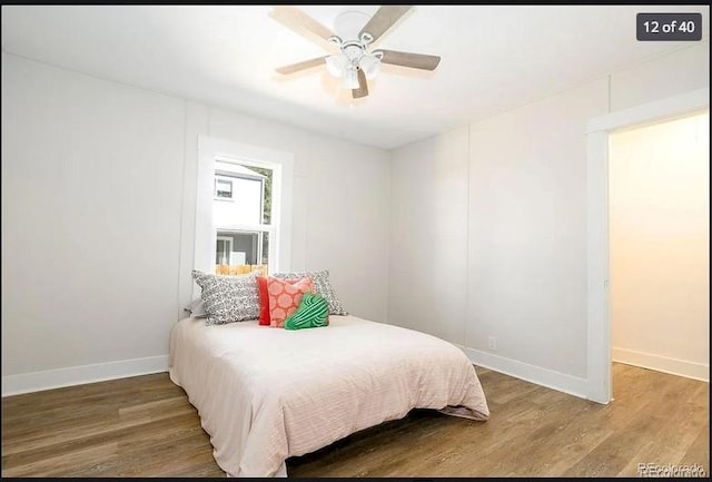 bedroom with ceiling fan and hardwood / wood-style flooring