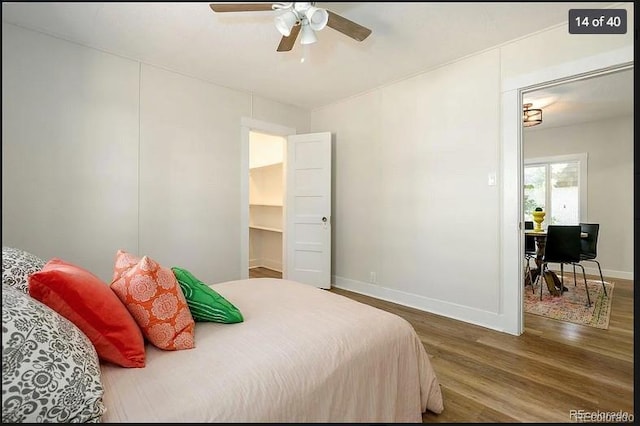 bedroom featuring hardwood / wood-style flooring and ceiling fan