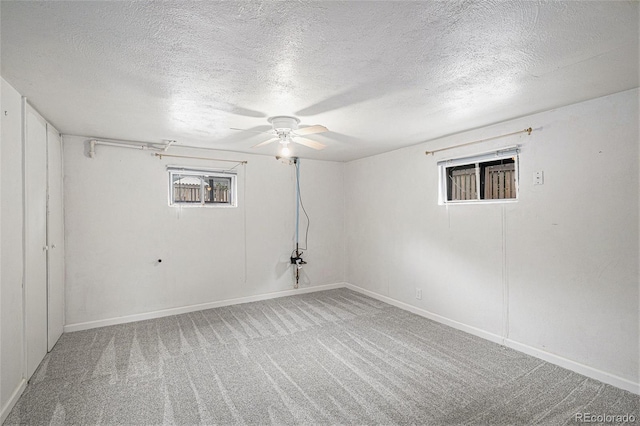 4051 S Cherokee St, Englewood, CO 80110 - basement featuring carpet, ceiling fan, and a textured ceiling