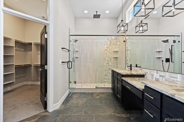 bathroom with tile patterned floors, vanity, and a shower with shower door