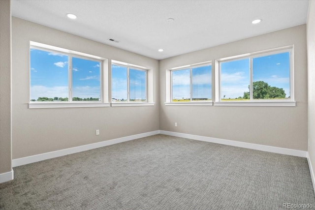 unfurnished room featuring carpet floors