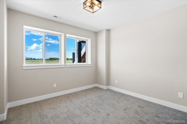 unfurnished room featuring carpet flooring