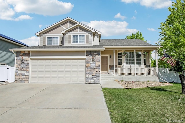 16304 10th St, Mead, CO 80542 - view of front of home with covered porch, concrete driveway, stone siding, and an attached garage