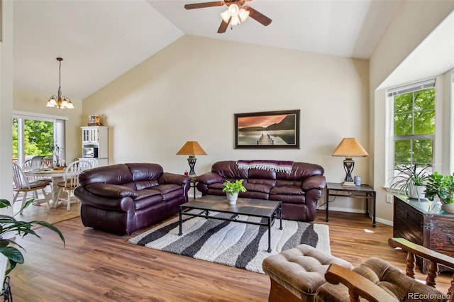 16304 10th St, Mead, CO 80542 - living area with a chandelier, plenty of natural light, ceiling fan, wood finished floors, and high vaulted ceiling