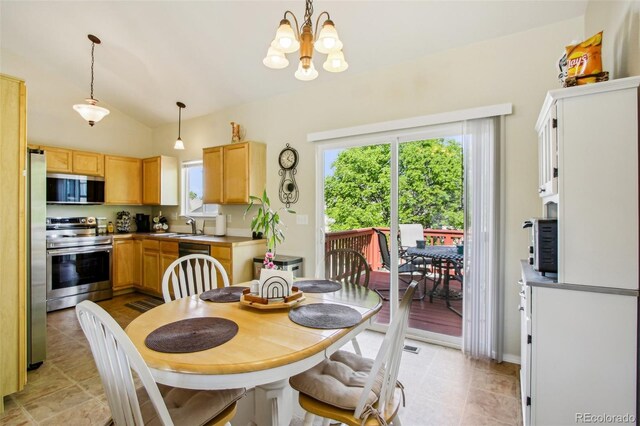 16304 10th St, Mead, CO 80542 - dining room featuring a chandelier, vaulted ceiling, and light tile patterned floors