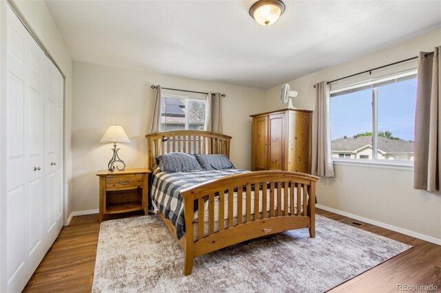 16304 10th St, Mead, CO 80542 - bedroom with a closet, wood finished floors, and baseboards