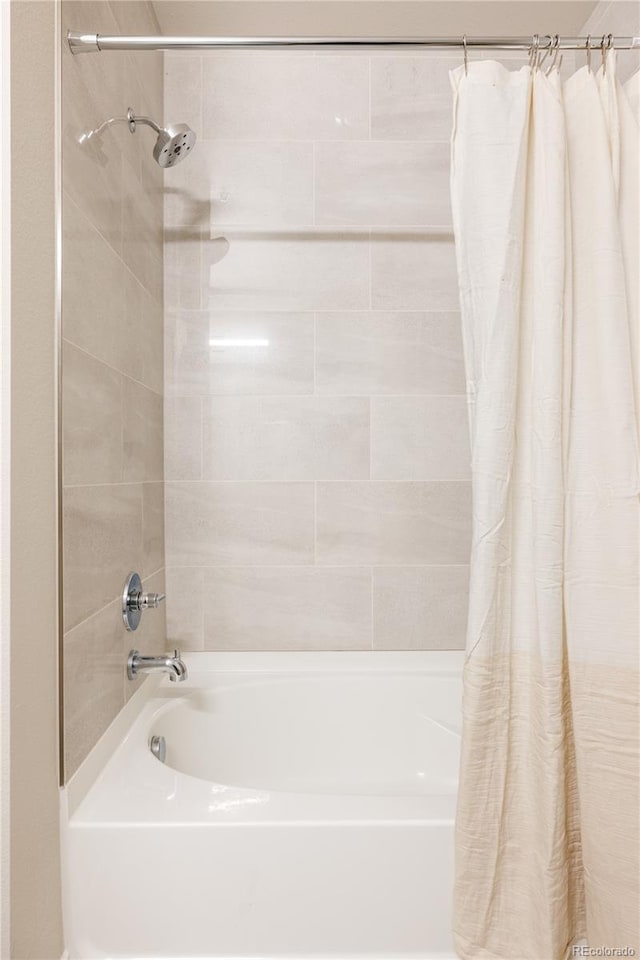 bathroom with shower / bath combo