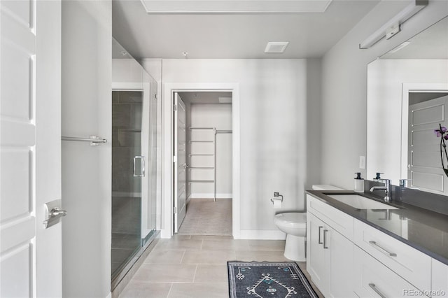 bathroom featuring vanity, toilet, an enclosed shower, and tile patterned flooring