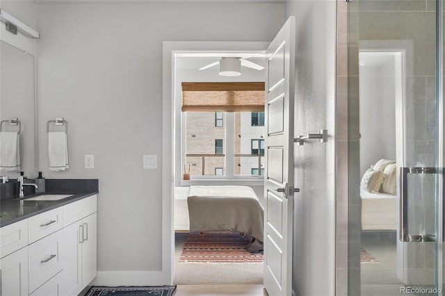 bathroom with vanity and a shower with shower door