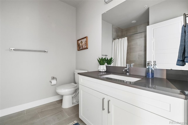 bathroom featuring vanity, toilet, and a shower with shower curtain