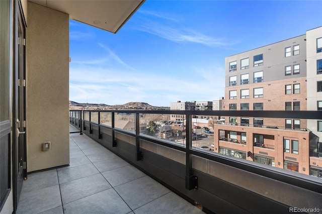 balcony featuring a mountain view