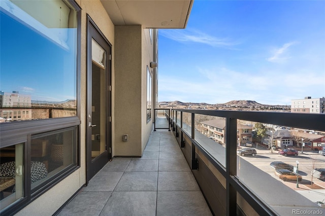 balcony featuring a mountain view