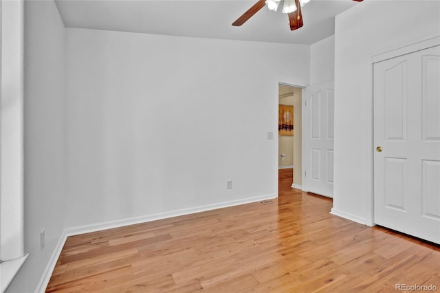 interior space with ceiling fan, light wood-style flooring, and baseboards